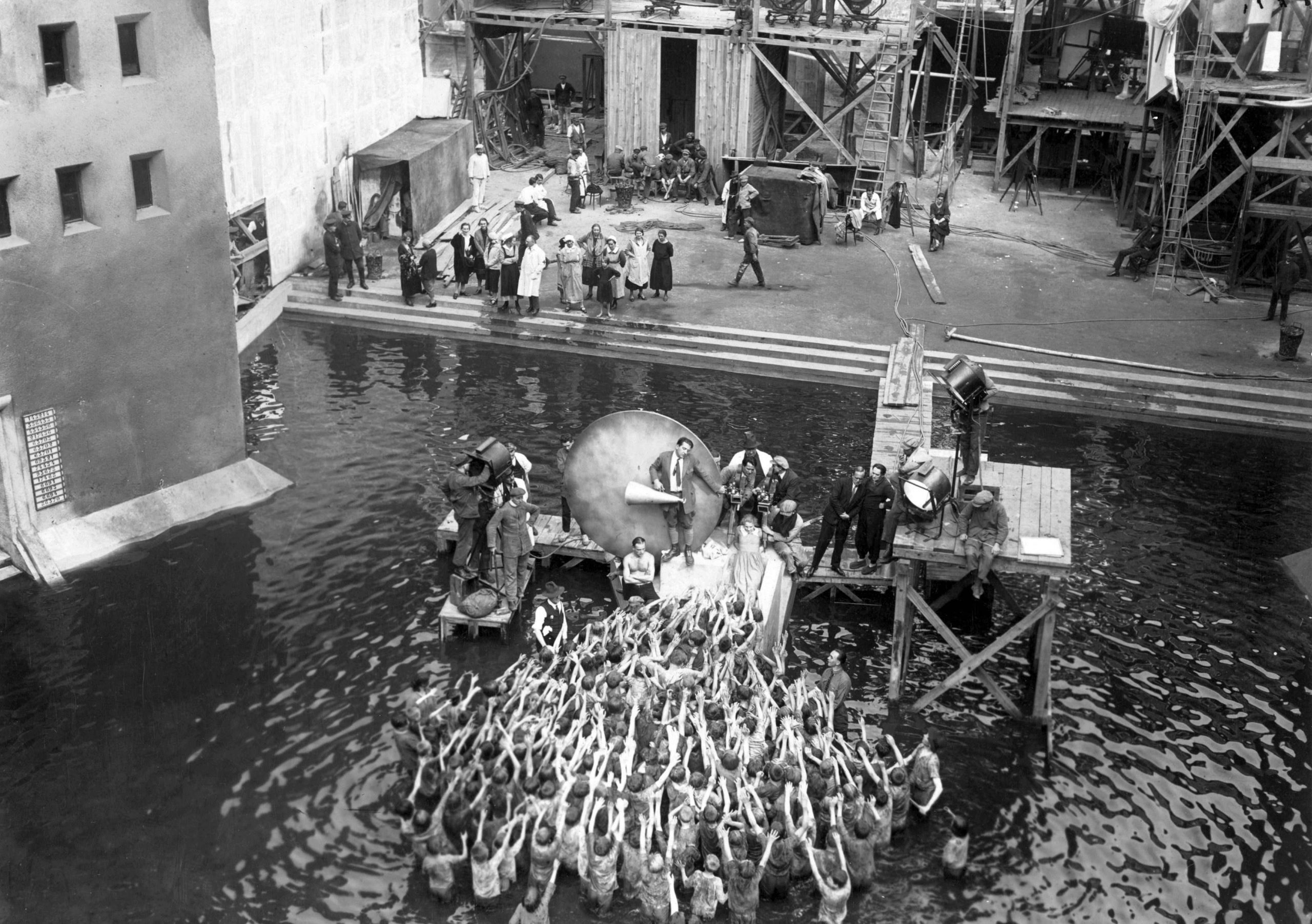 Metropolis (1927), During shooting of the flood, Fritz Lang with megaphone, production still. 