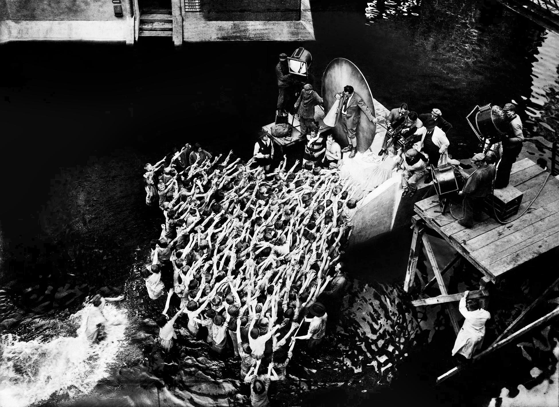 Metropolis (1927), During shooting of the flood, Fritz Lang with megaphone, production still. 
